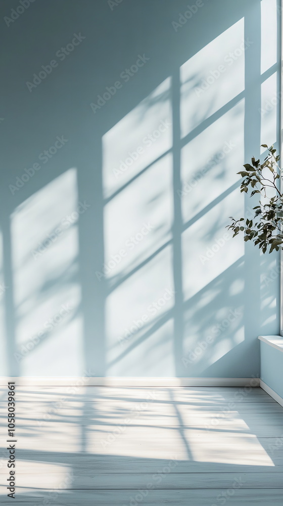 Aufkleber horizontal shadows from a large window crossing soft blue wall. neutral light filling a simple, empt