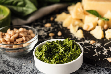 Homemade Pesto Sauce with Pine Nuts and Basil: Ingredients on Black Background