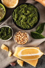 Homemade Pesto Sauce with Pine Nuts and Basil: Ingredients on Black Background