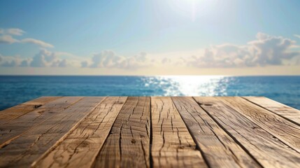 Fototapeta premium Wooden table against blurred summer sky and sea, with space for product display.