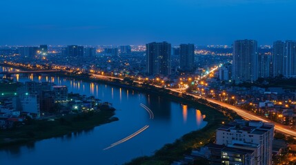 Naklejka premium Serene Cityscape at Dusk with Illuminated River and Skyscrapers