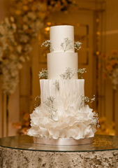 Large wedding ,white cake with initials and flowers