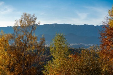 Fototapeta premium Autumn landscape with colorful trees and mountains.