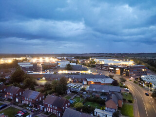 Obraz premium Aerial Footage of Illuminated Residential District Homes at Central Hitchin Town of England Great Britain. The Footage was Captured with Drone's Camera on October 28th, 2023 During Night.