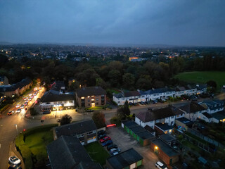 Obraz premium Aerial Footage of Illuminated Residential District Homes at Central Hitchin Town of England Great Britain. The Footage was Captured with Drone's Camera on October 28th, 2023 During Night.