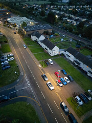 Aerial Footage of Illuminated Residential District Homes at Central Hitchin Town of England Great Britain. The Footage was Captured with Drone's Camera on October 28th, 2023 During Night.