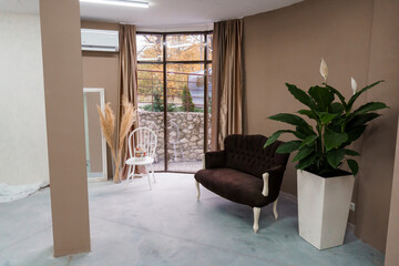 Fototapeta premium Cozy Modern Lounge Space with Natural Light and Elegant Decor