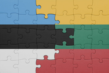 puzzle with the colourful national flag of estonia and flag of lithuania .