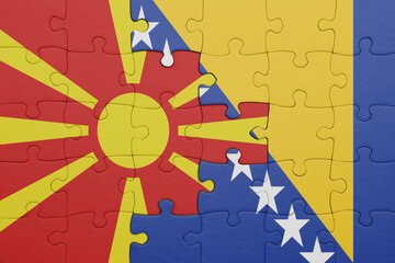 puzzle with the colourful national flag of macedonia and flag of bosnia and herzegovina .