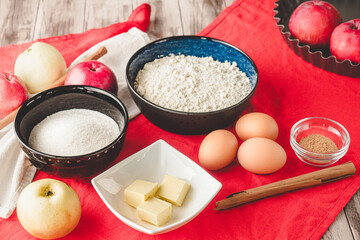 Ingredients Charlotte: A Delicious Apple Pie with Cinnamon on a Wooden Table