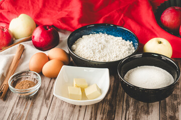 Ingredients Charlotte: A Delicious Apple Pie with Cinnamon on a Wooden Table