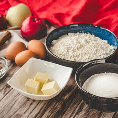 Ingredients Charlotte: A Delicious Apple Pie with Cinnamon on a Wooden Table