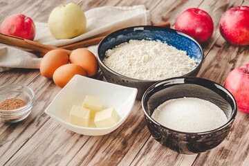 Ingredients Charlotte: A Delicious Apple Pie with Cinnamon on a Wooden Table