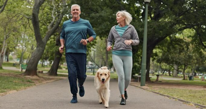 Senior couple, dog and running in park with fitness, care and love in morning with smile for chat. Mature man, woman and pet animal with workout, training and exercise on path for wellness in England