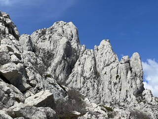 Rocky ridge of Tulove grede or karst mountain peak of Tulovice - Velebit Nature Park, Croatia (Stjenoviti greben Tulove grede ili krški planinski vrh Tulovice - Park prirode Velebit, Hrvatska)