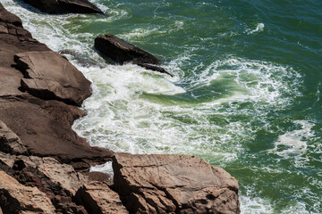 Serene Coastal Scene with Rocks and Gentle Waves