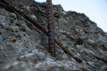 Rebar sticking out of a broken concrete wall