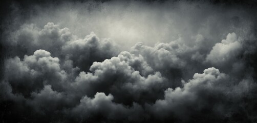Obraz premium Abstract grunge background with thick clouds in deep gray and black tones, textured with subtle scratches
