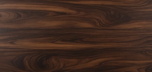 Fototapeta premium Dark walnut wood texture with deep, swirling grains, warm chocolate brown tones, and a polished finish