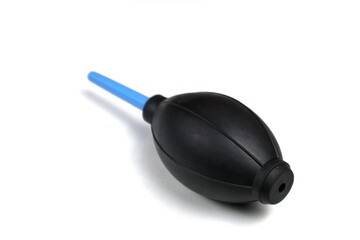 Rubber air blower pump dust cleaner isolated on white background. This tool can clean dust from...