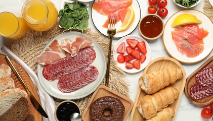 Different tasty food served for brunch on white marble table, flat lay