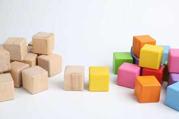Fototapeta premium Many wooden colorful cubes on white background
