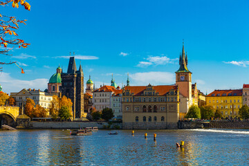 View over Vltava river of picturesque architectural ensemble of Prague embankment - Charles baths...