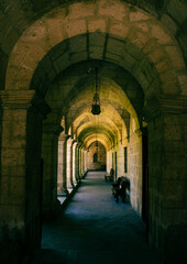 Obraz premium corridor inside the monastery illuminated by natural light