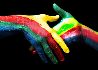 Diversity colors handshake with painted hands on black isolated backdrop. Handshake background...