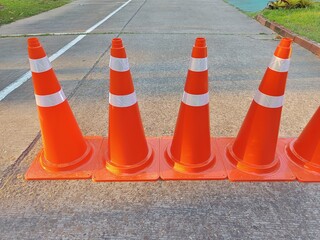 Road Closed: Five Orange Traffic Cones in a Row 
