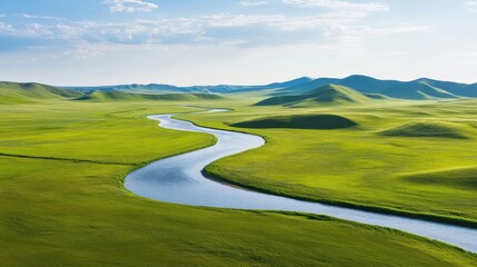 Obraz premium A peaceful landscape with a winding river cutting