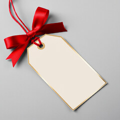 Blank gift tag and red ribbon bow with gold border on a transparent background