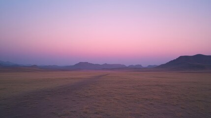Fototapeta premium A serene desert landscape at dusk, with the sky painted