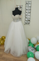 The bride's  dress before the wedding, placed on a mannequin