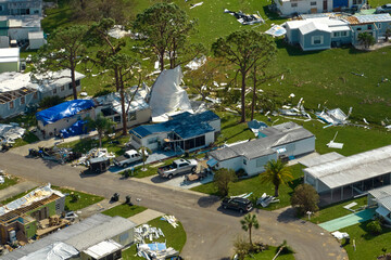 Destroyed by hurricane Ian suburban houses in Florida mobile home residential area. Consequences of...