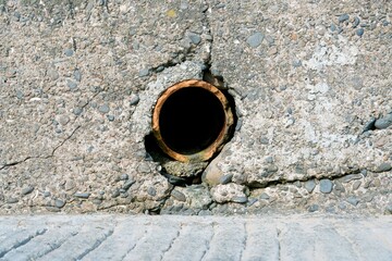 Blacked-Out Pipe in Concrete Surface: Industrial Detail and Design