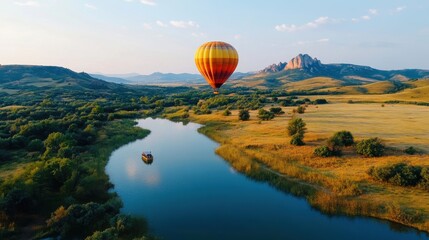 Obraz premium Colorful Balloon Over Scenic Landscape