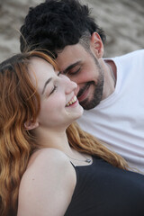 Fototapeta premium closeup portrait of cute loving young couple on the beach