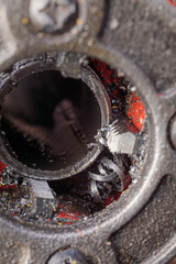 A close-up of a threading die, also known as a pipe die, used for cutting threads on steel pipes,...