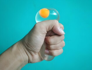 Transparent squishy egg toy with realistic yolk, perfect for stress relief and sensory play