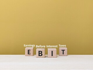 the letters EBIT or Earnings Before Interest and Taxes. business finance. education