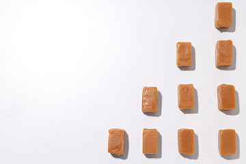 Cubes of salted caramel on a white background