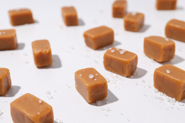 Cubes of salted caramel on a white background