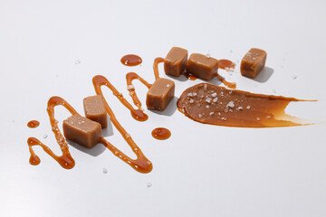 Cubes of salted caramel on a white background