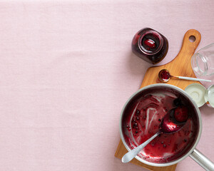 berries confiture or jam. Cooking fresh fruit in a pan, copy space