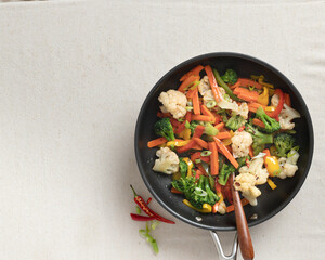 Sauted mixed vegetables in frying pan, overhead 