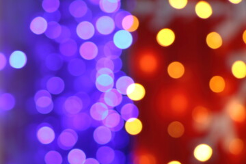 Many soft blue, purple, orange, red and yellow blurry bokeh light in Christmas and New Year festival day, can use for background
