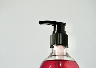 Shampoo or body wash bottle container bottle pump isolated on horizontal ratio white background.