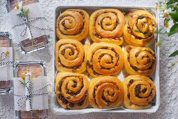 freshly baked homemade cinnamon mix fruit morning rolls in baking tray.