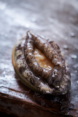 Fresh abalone on cutting board